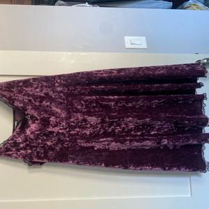 Purple velvet dress with crystal and lace detailing. Size is plus size 2.